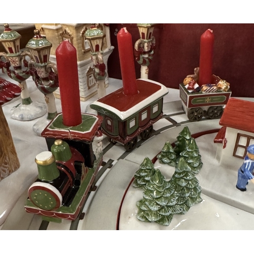 215 - A quantity of Villeroy & Boch Christmas track & train set & extras (most in boxes), 1 train A/F has ... 