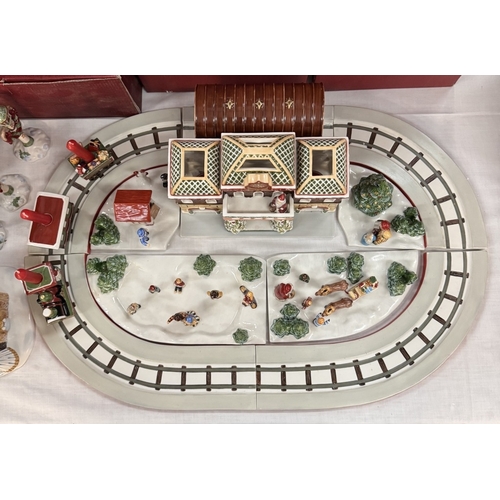 215 - A quantity of Villeroy & Boch Christmas track & train set & extras (most in boxes), 1 train A/F has ... 