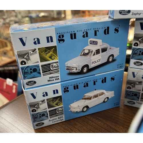 217 - 17 boxed Vanguards die cast police vehicles