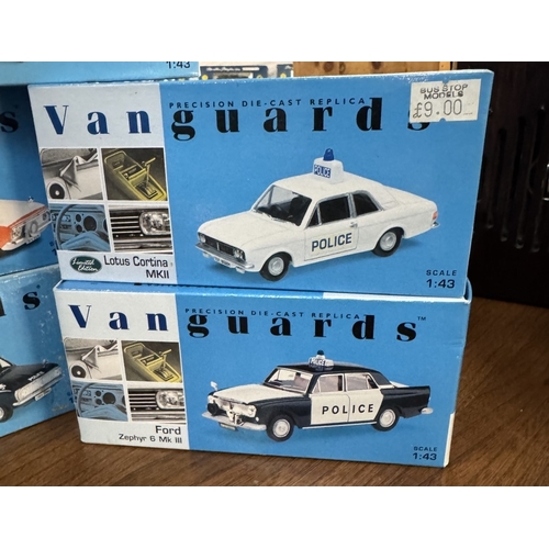 217 - 17 boxed Vanguards die cast police vehicles