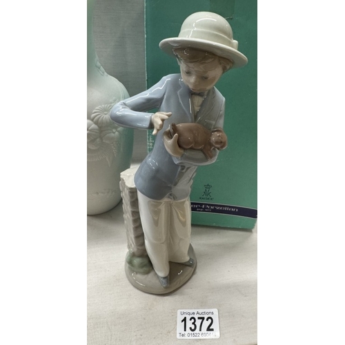 1372 - A boxed Kaiser porcelain vase & a Nao figure boy with puppy