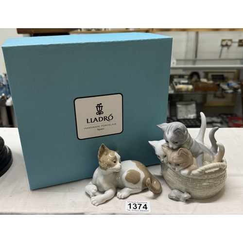 1374 - A boxed Lladro kitten in basket & another unboxed