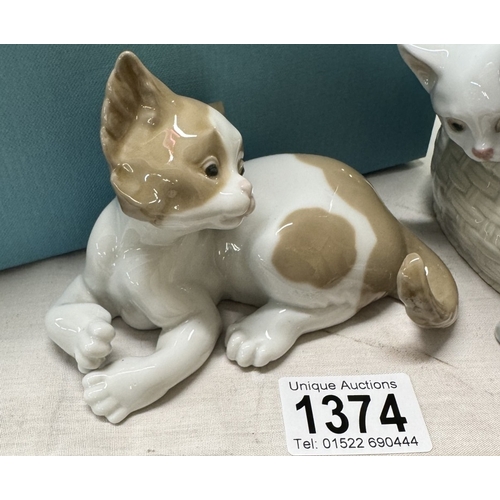 1374 - A boxed Lladro kitten in basket & another unboxed