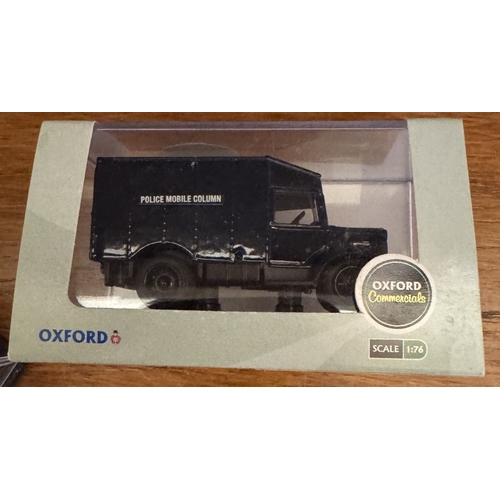 234 - A quantity of boxed Oxford Die cast 1/76 scale including Police & military vehicles