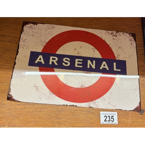 235 - A selection of Arsenal football merchandise