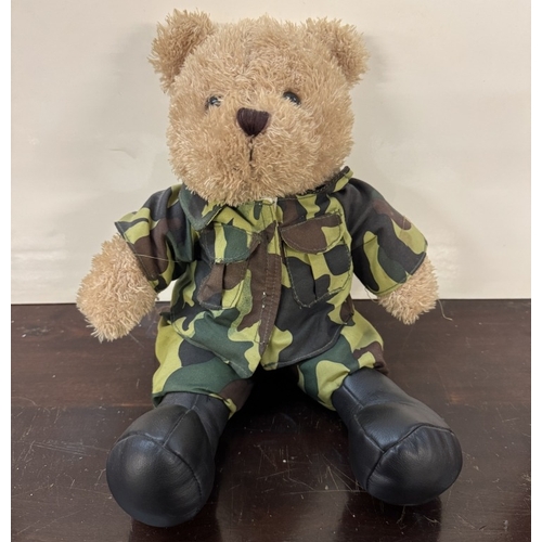 242 - A Military dressed singing Doll & a Teddy Bear