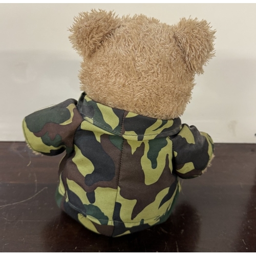 242 - A Military dressed singing Doll & a Teddy Bear