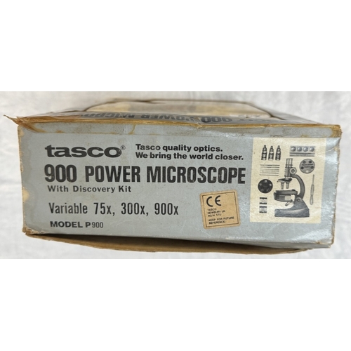 249 - A boxed Tasco 900 power microscope