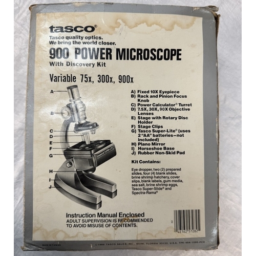 249 - A boxed Tasco 900 power microscope