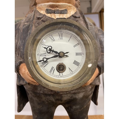 1094 - A cast iron male figure clock.