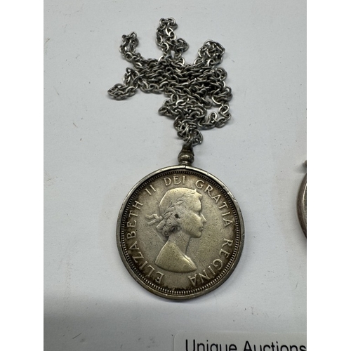 1175 - An 1890 Victoria silver crown in mount & 1963 silver Canada dollar in silver coloured metal mount & ... 