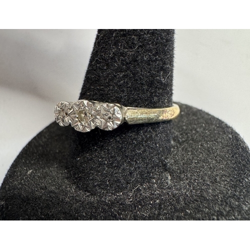 1180 - An 18ct gold & platinum ring with 3 small diamonds 2.44gms