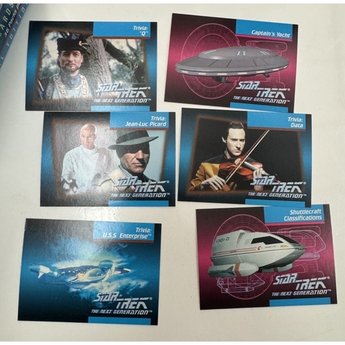 302 - An album of Star Trek cards in an unopened box of Panini Star Trek NG stickers & an opened box of St... 