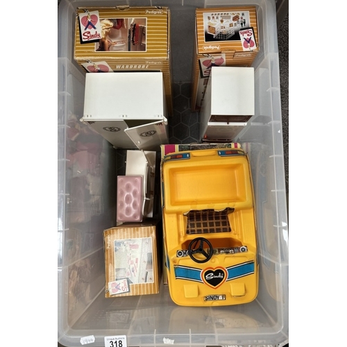 318 - A good lot of Sindy boxed items , Bussy, wardrobe, dressing table etc. plus garden furniture, Dolls,... 