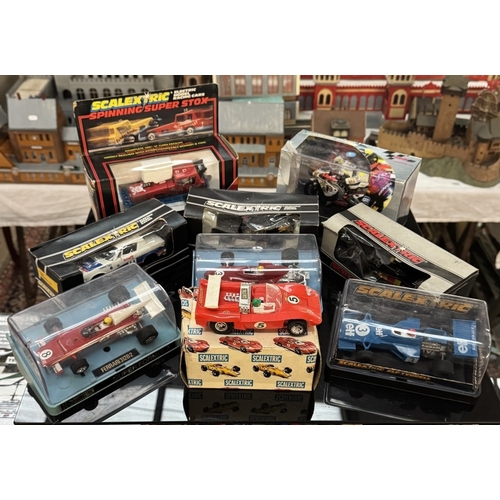 322 - A boxed Scalextric Rally Cross set with cars, a quantity of Scalextric boxed cars & a quantity of ex... 