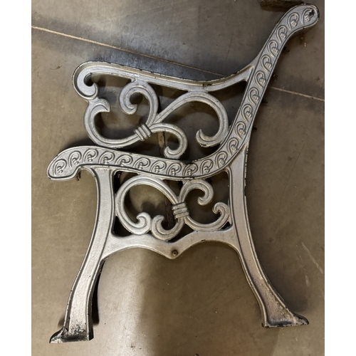 1438 - A pair of cast iron garden bench ends. COLLECT ONLY.