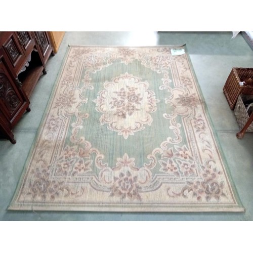 359 - A green patterned rug from Dunelm Mill - 170cm x 230cm COLLECT ONLY.