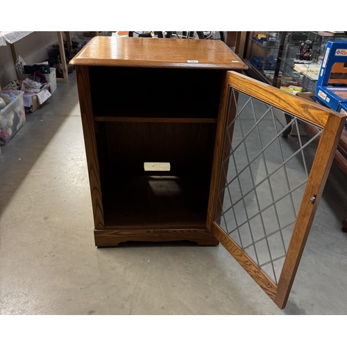 341 - A medium oak display cabinet with leaded glass door COLLECT ONLY