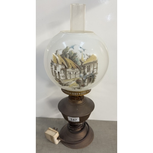 347 - An electric brass oil lamp with thatched cottage shade & a Seiko Westminster/Whittington chime quart... 