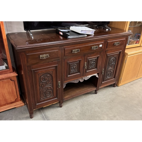 354 - A mahogany sideboard with carved floral panels, 158cm x 52cm x 94cm COLLECT ONLY.