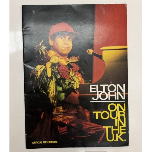 358 - A quantity of music memorabilia including signed Eric Clapton 1988 25 programme, Elton John on tour ... 