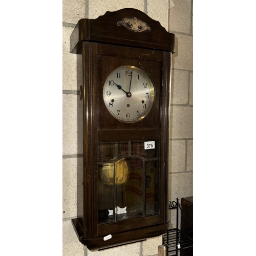 375 - A 1930's oak wall clock with bevel glass panels COLLECT  ONLY