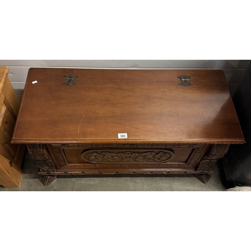 380 - A dark wood stained blanket box with carved frontage COLLECT ONLY