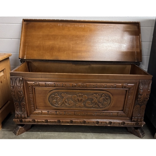 380 - A dark wood stained blanket box with carved frontage COLLECT ONLY