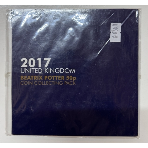 1200D - An interesting album of 20 coin covers & other coin sets including US $5 Pearl Harbour, UK Jubilee £... 