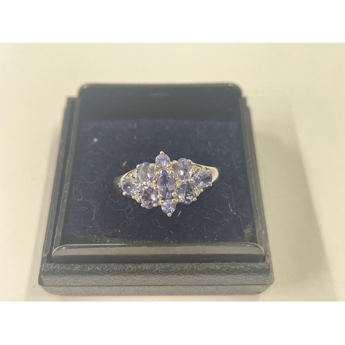 1009 - A 9ct yellow gold diamond and tanzanite ring, size P half, 2.8 grams.