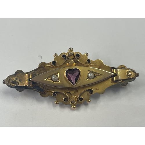 1017 - A Victorian 9ct gold brooch set amethyst and seed pearls, 5 cm wide, 3.98 grams.