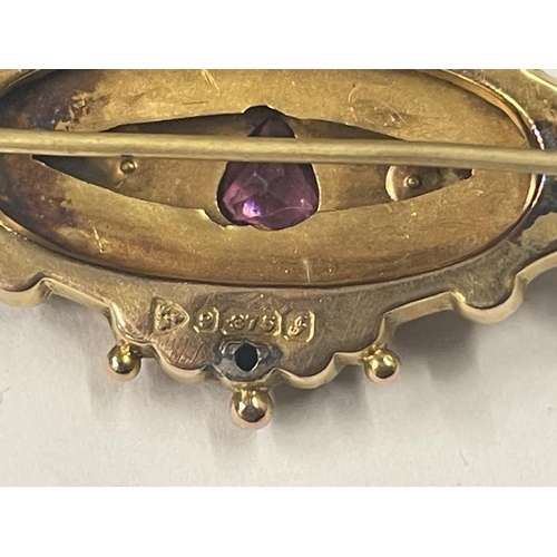 1017 - A Victorian 9ct gold brooch set amethyst and seed pearls, 5 cm wide, 3.98 grams.