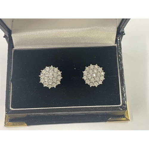 1019 - A pair of white 9ct gold fine diamond earrings, total weight 5 grams.