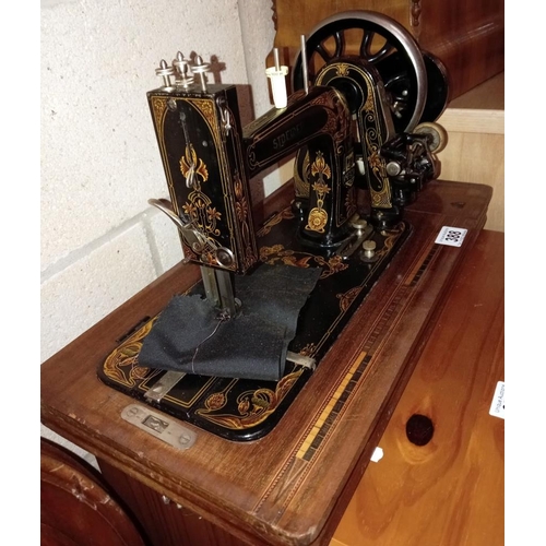 388 - A vintage Stower sewing machine in case