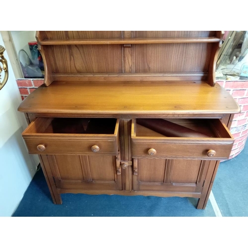 389 - An Ercol medium oak dresser