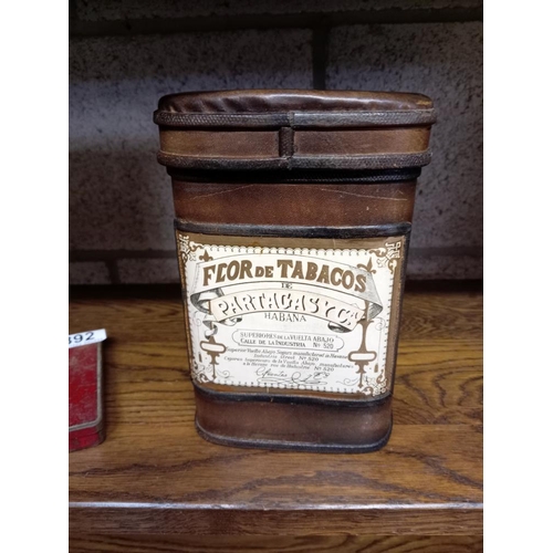 392 - A vintage leather Flor De Tabacos cigar box with cigars & 2 cigarette tins including Craven A