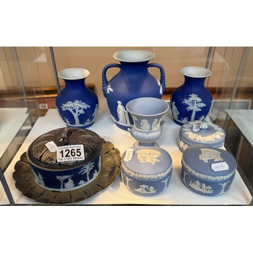 1265 - A quantity of Wedgwood Jasper ware including vases, trinket boxes, butter dish (a/f),etc.,