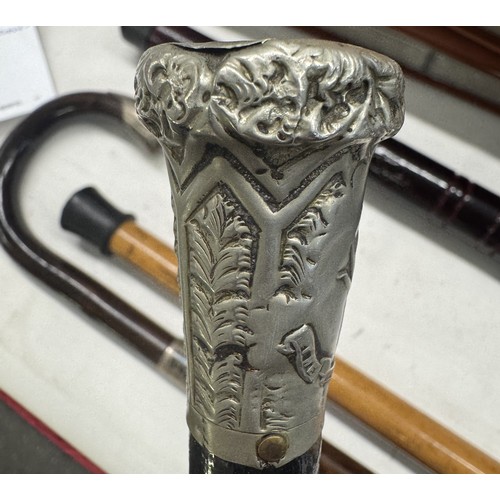 1387 - 2 walking sticks with silver fittings & another with 'The Welsh Guards' end cap & 1 other