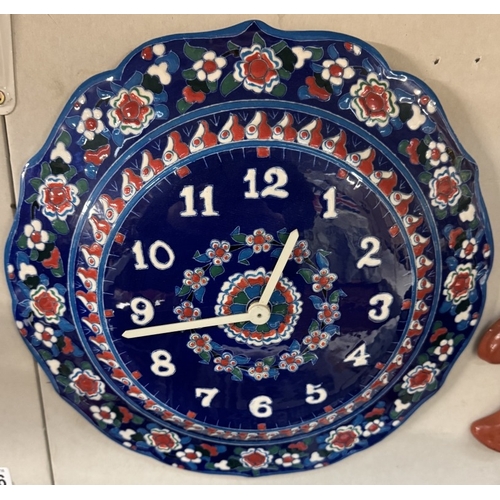 1677 - A ceramic garden 'sun' face & a ceramic clock