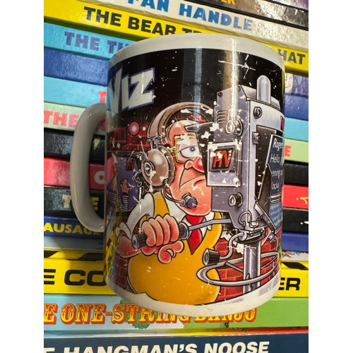 142 - A good collection of Viz annuals, other Viz books & A Viz mug.