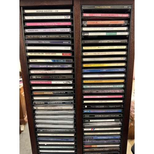 1705 - A good lot of CD's & DVD's including Christine in Blu-Ray & a CD stand COLLECT ONLY