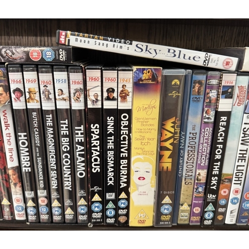 1795 - A quantity of DVDs including Laurel & Hardy & John Wayne box sets