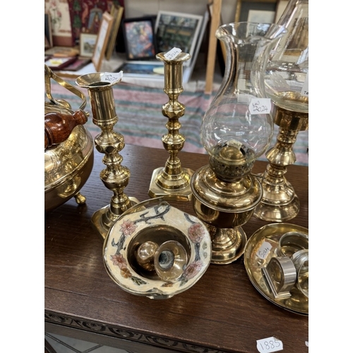 1856 - A Victorian brass trivet, 2 pairs of candlesticks & other brassware including oil lamps, kettle etc