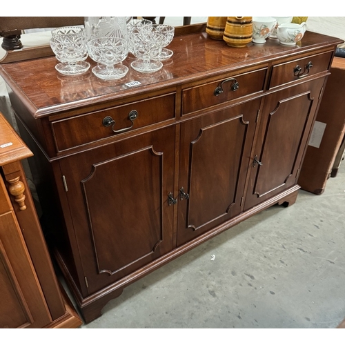 1879 - A mahogany effect 3 drawer, 3 door wall unit COLLECT ONLY