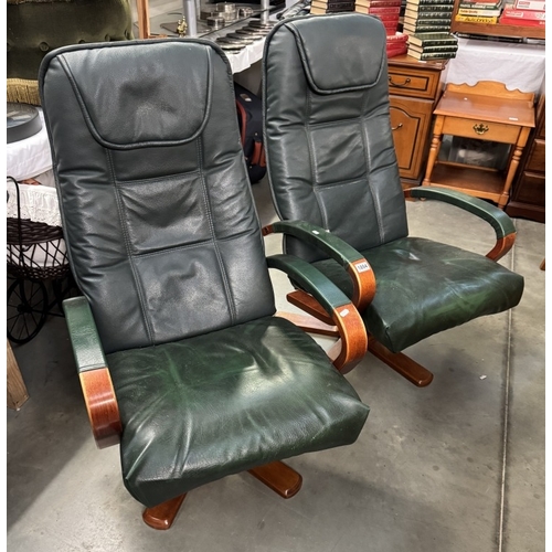 1894 - A pair of green leather reclining swivel chairs COLLECT ONLY