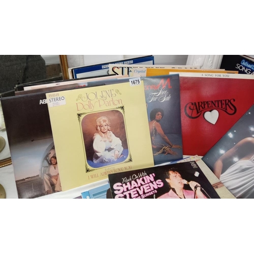 1675 - A quantity of vinyl records including Donna Summer, Dolly Parton etc