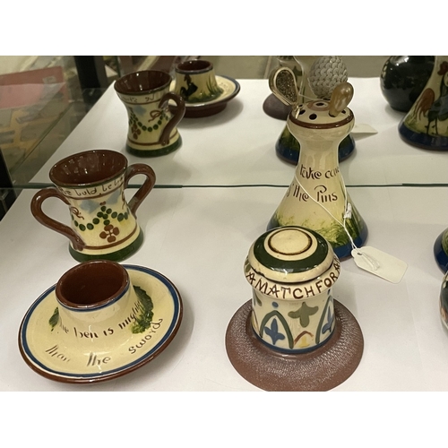 1682 - Six items of Torquay Motto ware including hat pin stands.