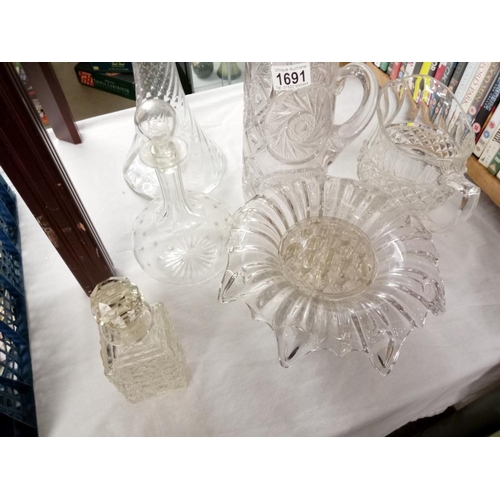 1691 - A quantity of glassware including vintage decanter, large vase & jugs etc.