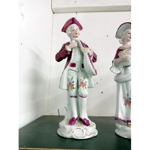 1731 - A continental unglazed bisque figurine, Height 30cm & another pair with glazed finish, Height 30cm