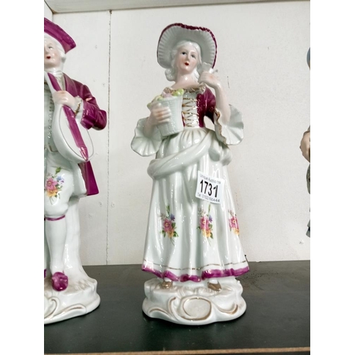 1731 - A continental unglazed bisque figurine, Height 30cm & another pair with glazed finish, Height 30cm